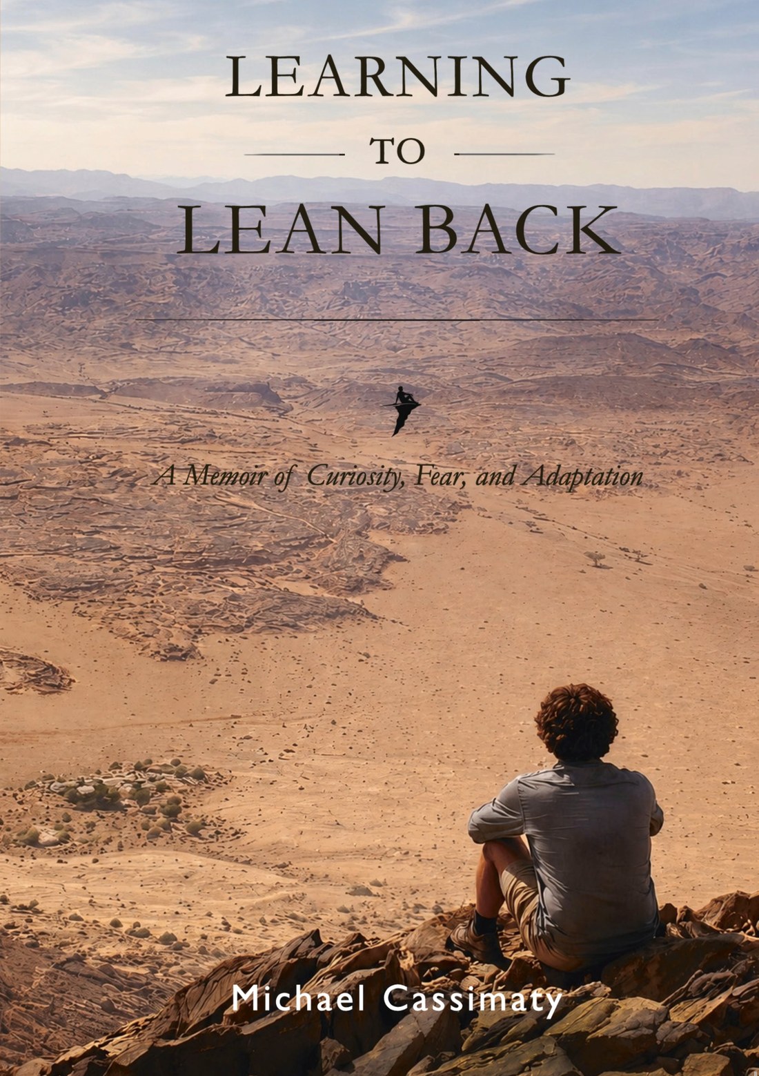 Cover of Learning to Lean Back: A Memoir by Michael Cassimaty, showing Michael seated on a rocky ridge looking out over the Sinai desert